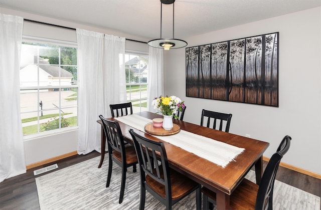 14449 Briarwood Ln, Urbandale, IA 50323 - dining area with baseboards and wood finished floors
