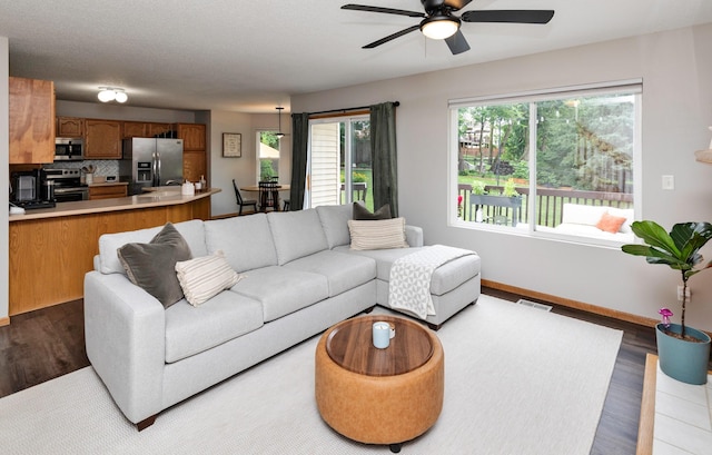 14449 Briarwood Ln, Urbandale, IA 50323 - living room with a ceiling fan and wood finished floors