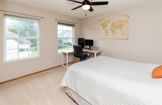 14449 Briarwood Ln, Urbandale, IA 50323 - carpeted bedroom with baseboards and a ceiling fan