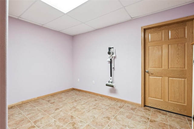7 Hobart Pl, Grinnell, IA 50112 - empty room featuring a paneled ceiling and baseboards