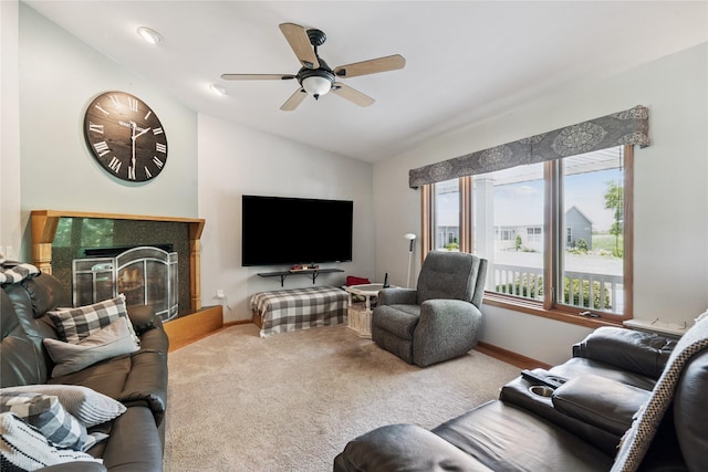 7 Hobart Pl, Grinnell, IA 50112 - carpeted living area featuring vaulted ceiling, a ceiling fan, and a fireplace
