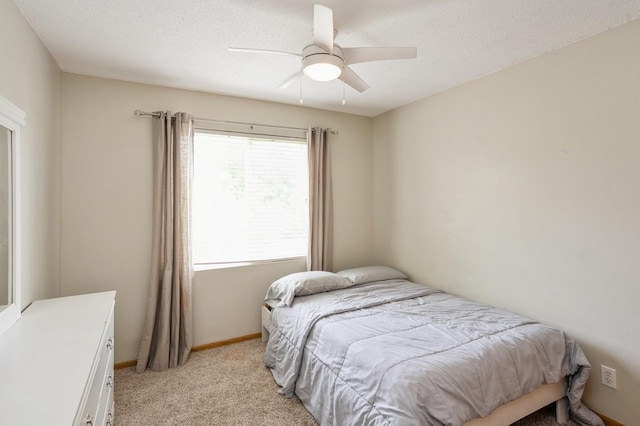 681 63rd St, West Des Moines, IA 50266 - bedroom with light colored carpet, a ceiling fan, and a textured ceiling