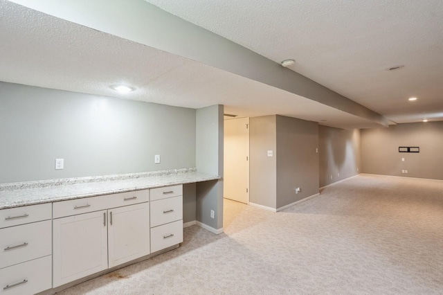 681 63rd St, West Des Moines, IA 50266 - finished below grade area with light carpet, recessed lighting, and a textured ceiling
