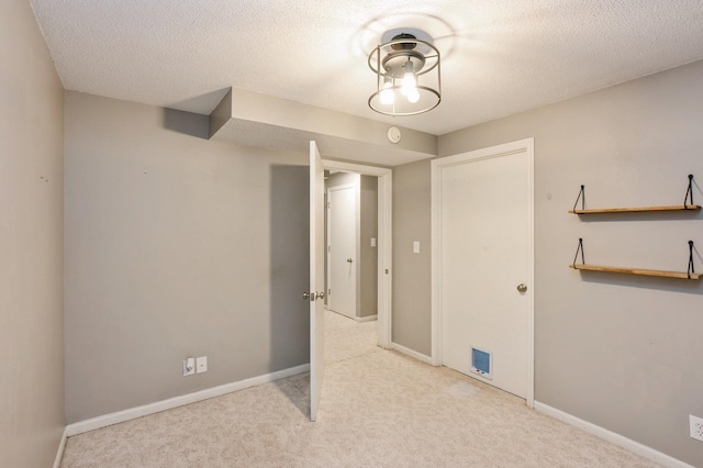 681 63rd St, West Des Moines, IA 50266 - unfurnished bedroom featuring carpet floors and a textured ceiling