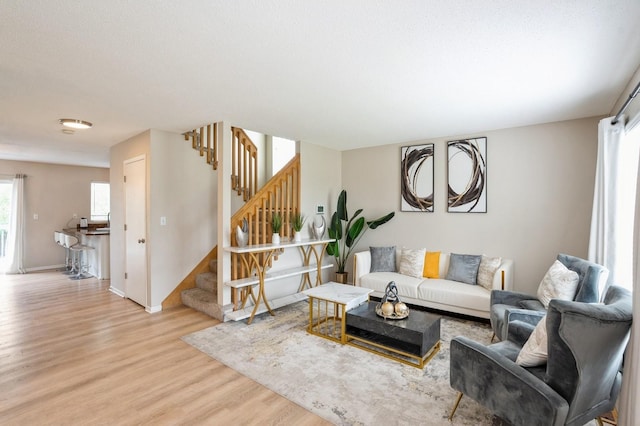 681 63rd St, West Des Moines, IA 50266 - living room with light wood finished floors and stairway