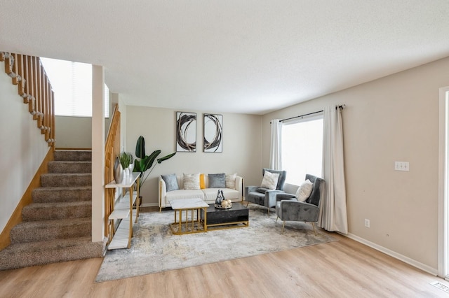 681 63rd St, West Des Moines, IA 50266 - living room featuring wood finished floors and stairway