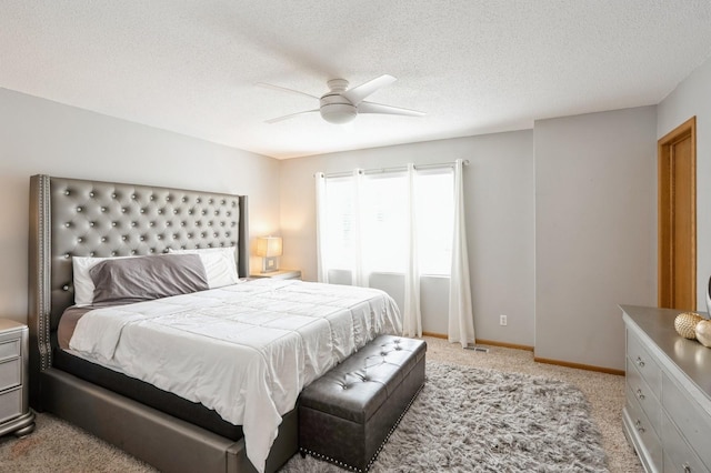 681 63rd St, West Des Moines, IA 50266 - bedroom with light colored carpet, ceiling fan, and a textured ceiling