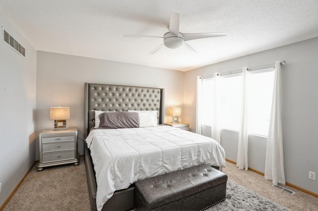 681 63rd St, West Des Moines, IA 50266 - carpeted bedroom with a ceiling fan and a textured ceiling
