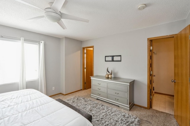681 63rd St, West Des Moines, IA 50266 - carpeted bedroom featuring a textured ceiling and a ceiling fan
