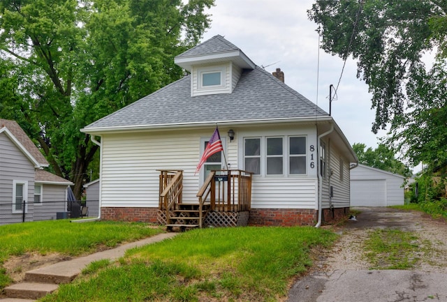 816 Boyd St, Des Moines, IA 50316 - bungalow-style home with roof with shingles, an outdoor structure, and a chimney
