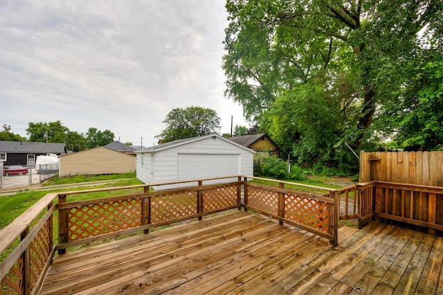 816 Boyd St, Des Moines, IA 50316 - deck featuring a detached garage and an outbuilding