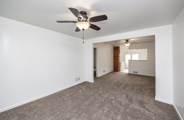 816 Boyd St, Des Moines, IA 50316 - unfurnished room with a ceiling fan and dark carpet