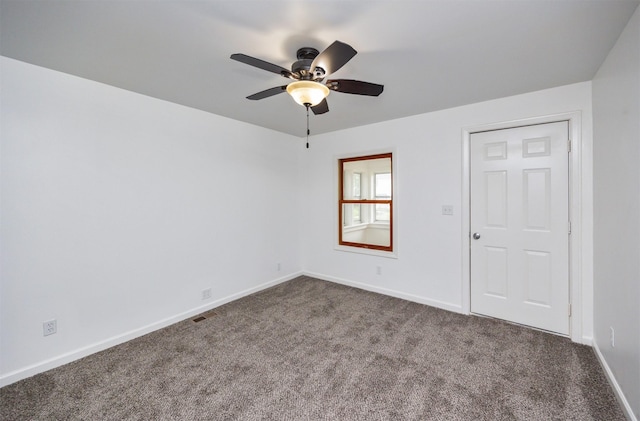 816 Boyd St, Des Moines, IA 50316 - spare room with dark carpet and a ceiling fan