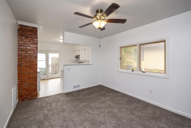 816 Boyd St, Des Moines, IA 50316 - empty room with a ceiling fan and carpet