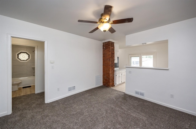 816 Boyd St, Des Moines, IA 50316 - unfurnished bedroom with ornate columns, carpet flooring, and ensuite bath