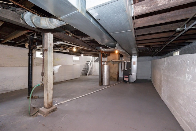816 Boyd St, Des Moines, IA 50316 - basement featuring stairway, gas water heater, and heating unit
