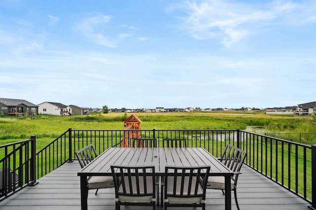 2309 NW 29th St, Ankeny, IA 50023 - deck featuring outdoor dining space and a yard