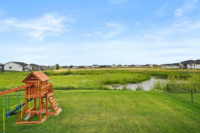 2309 NW 29th St, Ankeny, IA 50023 - view of yard with a playground and a water view