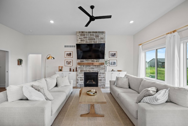 2309 NW 29th St, Ankeny, IA 50023 - living area featuring a ceiling fan, a stone fireplace, recessed lighting, and wood finished floors