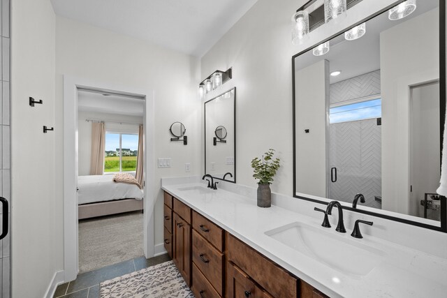 2309 NW 29th St, Ankeny, IA 50023 - ensuite bathroom featuring double vanity, plenty of natural light, and a shower stall