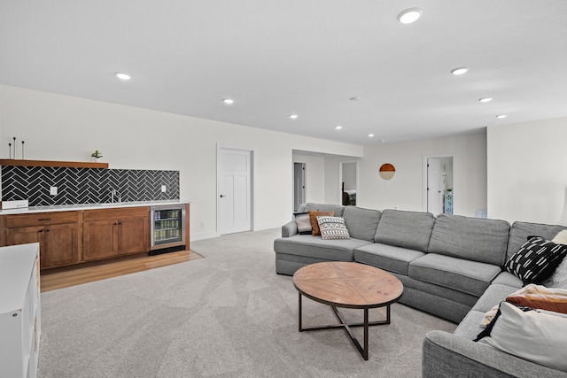 2309 NW 29th St, Ankeny, IA 50023 - living area with beverage cooler, recessed lighting, light colored carpet, and a bar