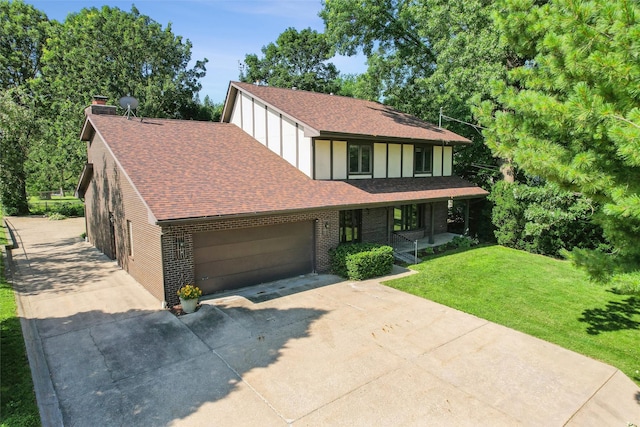 6542 Washington Ave, Windsor Heights, IA 50324 - tudor home featuring covered porch, a front lawn, driveway, a shingled roof, and a garage