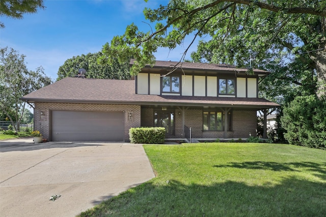 6542 Washington Ave, Windsor Heights, IA 50324 - english style home featuring concrete driveway, a garage, a front yard, brick siding, and covered porch
