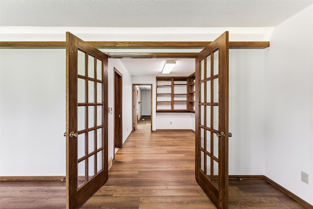 6542 Washington Ave, Windsor Heights, IA 50324 - hall with french doors and wood finished floors
