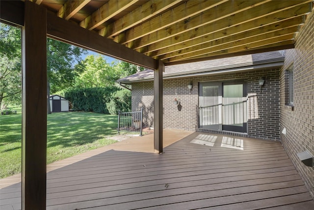 6542 Washington Ave, Windsor Heights, IA 50324 - wooden deck with a storage shed and a lawn