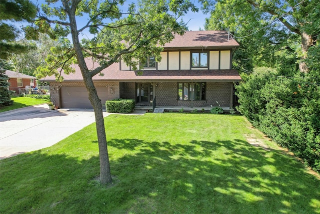 6542 Washington Ave, Windsor Heights, IA 50324 - tudor home featuring driveway, a garage, brick siding, and a porch