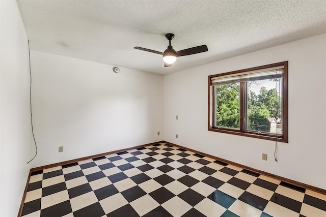 6542 Washington Ave, Windsor Heights, IA 50324 - spare room featuring light floors, a ceiling fan, and a textured ceiling