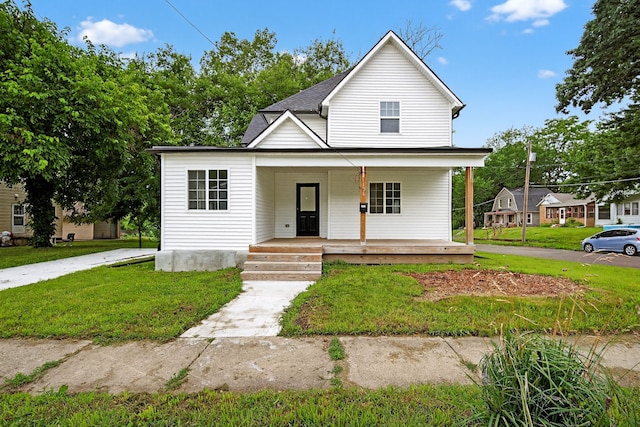 1124 13th St, Des Moines, IA 50314 - view of front of house with a porch and a front lawn