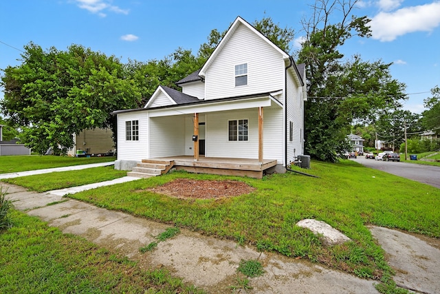 1124 13th St, Des Moines, IA 50314 - view of front of house with a porch and a front lawn