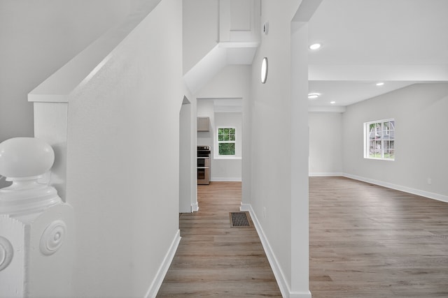 1124 13th St, Des Moines, IA 50314 - hall featuring plenty of natural light, wood finished floors, and recessed lighting