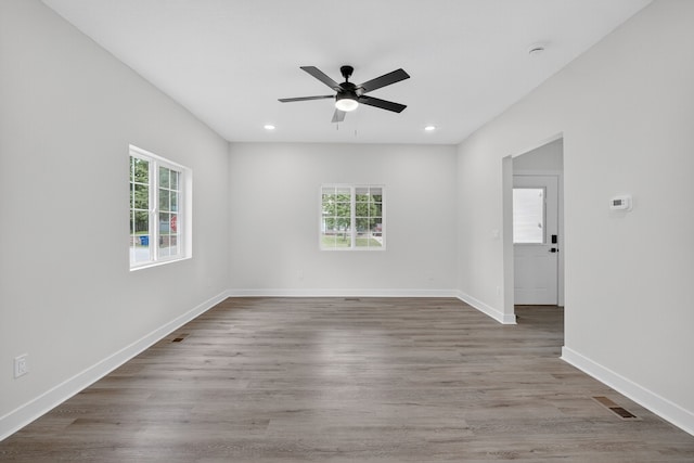 1124 13th St, Des Moines, IA 50314 - spare room featuring ceiling fan, recessed lighting, and wood finished floors