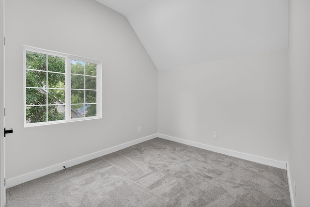 1124 13th St, Des Moines, IA 50314 - bonus room with vaulted ceiling and carpet flooring