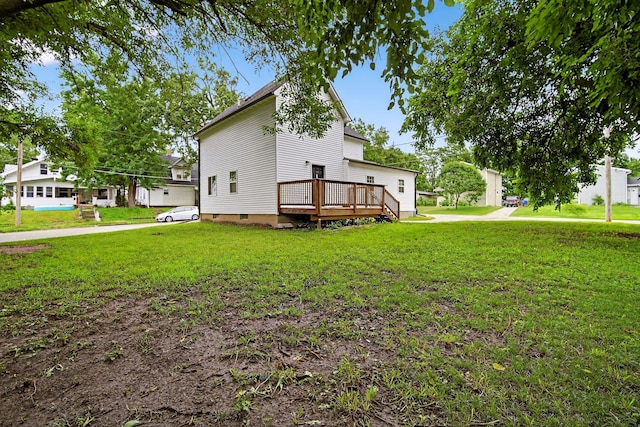 1124 13th St, Des Moines, IA 50314 - view of home's exterior with a deck, a yard, and crawl space