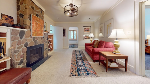 3827 Carpenter Ave, Des Moines, IA 50311 - carpeted living area featuring arched walkways, crown molding, and a fireplace