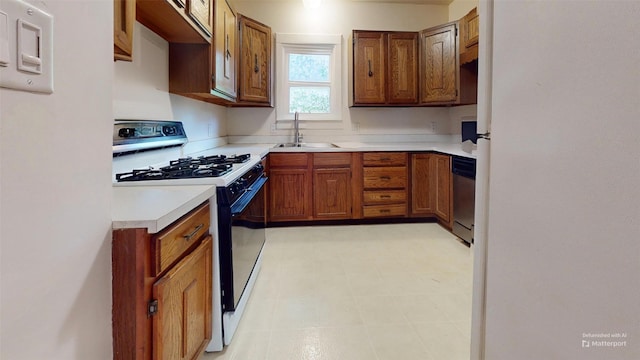 3827 Carpenter Ave, Des Moines, IA 50311 - kitchen featuring black range with gas cooktop, light countertops, brown cabinetry, and dishwasher