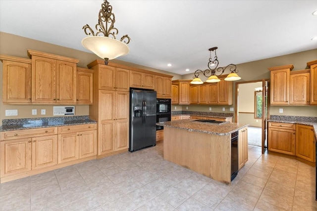 704 SW Coventry Cir, Ankeny, IA 50023 - kitchen with black appliances, dark stone counters, a center island, decorative light fixtures, and recessed lighting