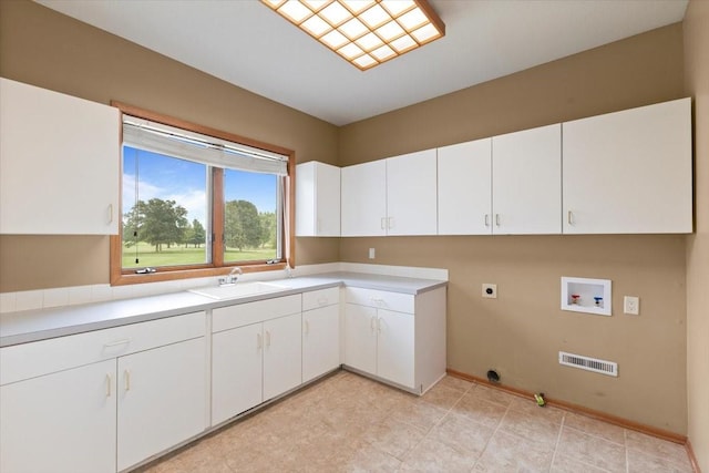 704 SW Coventry Cir, Ankeny, IA 50023 - washroom featuring hookup for a washing machine, hookup for an electric dryer, and cabinet space