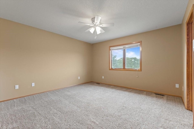 704 SW Coventry Cir, Ankeny, IA 50023 - empty room with a ceiling fan and light carpet