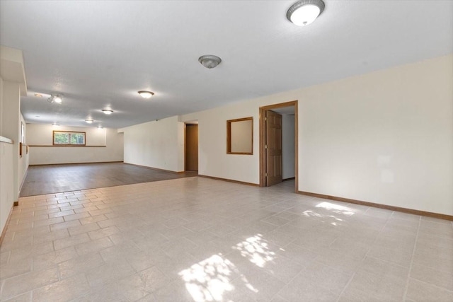 704 SW Coventry Cir, Ankeny, IA 50023 - empty room featuring baseboards and light tile patterned floors