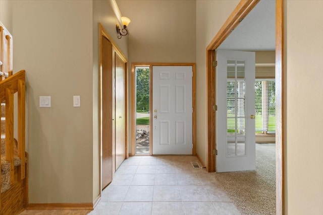 704 SW Coventry Cir, Ankeny, IA 50023 - foyer featuring light tile patterned floors and french doors