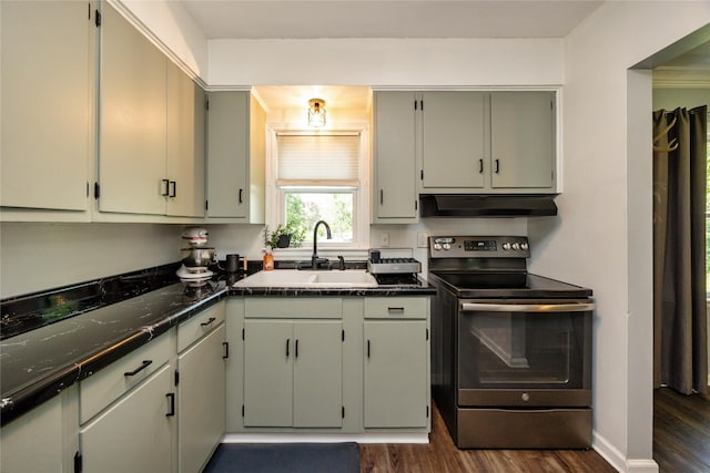 4207 Madison Ave, Des Moines, IA 50310 - kitchen featuring electric stove, under cabinet range hood, dark wood finished floors, and dark countertops