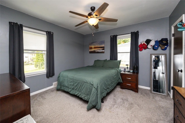 4207 Madison Ave, Des Moines, IA 50310 - bedroom featuring light colored carpet and a ceiling fan