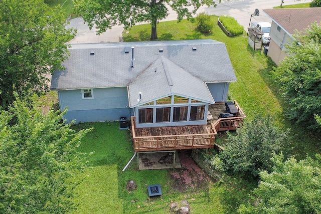 1018 S 5th St, Knoxville, IA 50138 - back of house featuring a wooden deck and a lawn