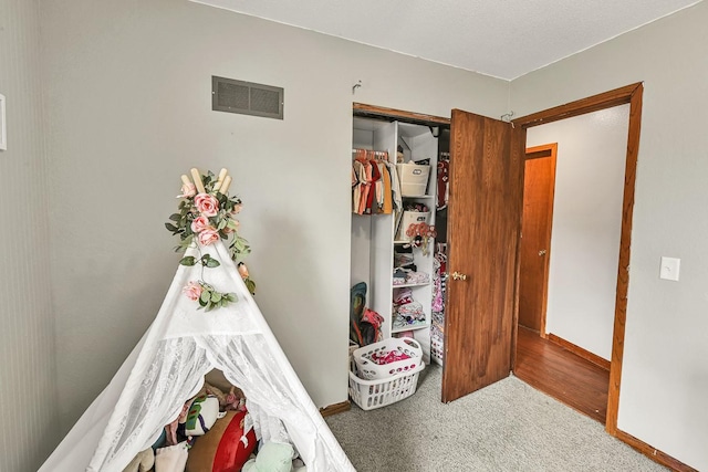 1018 S 5th St, Knoxville, IA 50138 - carpeted bedroom featuring baseboards and a closet