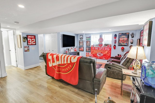 1018 S 5th St, Knoxville, IA 50138 - living room featuring light wood-type flooring and recessed lighting