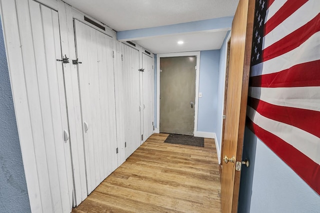 1018 S 5th St, Knoxville, IA 50138 - hall featuring wood finished floors